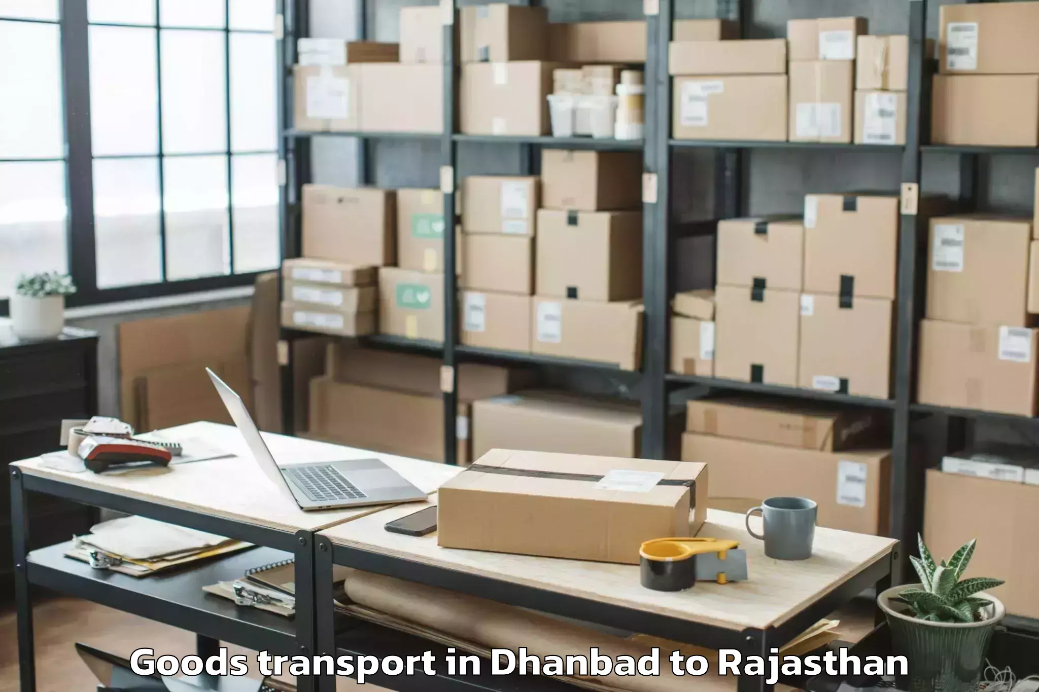 Top Dhanbad to Rajakhera Goods Transport Available